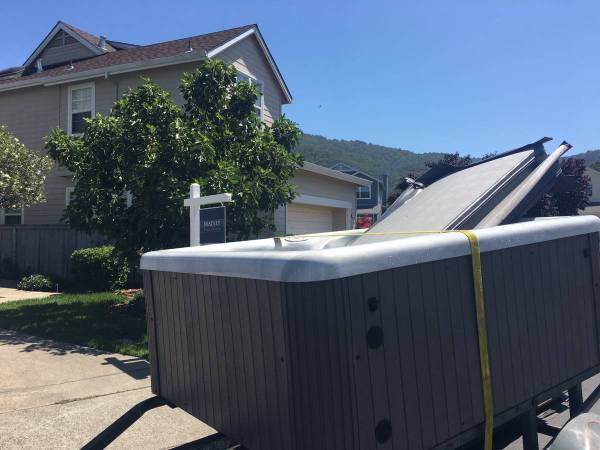 Hot tub strapped on a trailer for delivery in the Bay Area